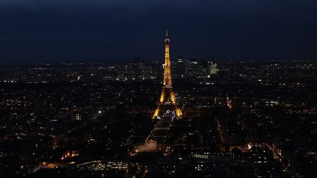 Aerial view of the illuminated Eiffel Tower at night France. Aerial view of the illuminated Eiffel Tower at night France.