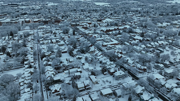 Aerial view of Lititz covered in fresh snow at dawn featuring residential streets historic buildings and tree lined roads in Lititz Pennsylvania United States. Aerial view of Lititz covered in fresh snow at dawn featuring residential streets historic buildings and tree lined roads in Lititz Pennsylvania United States.