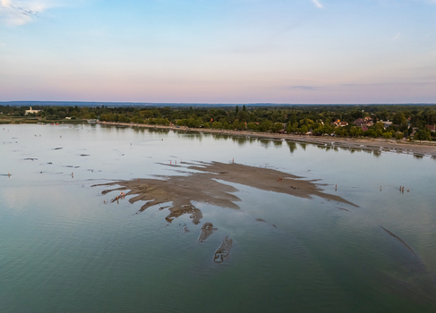 Aerial view of Monkey Island at Lake Balaton during summer drought at dusk Aerial view of Monkey Island at Lake Balaton during summer drought at dusk
