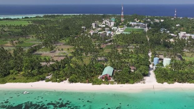Aerial view of the tropical island of Thoddoo Maldives. Aerial view of the tropical island of Thoddoo Maldives.