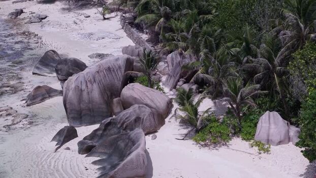 Aerial view of Anse Reunion beach with granite boulders Seychelles.