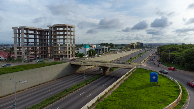 Accra Ghana 02 June 2023 Aerial view of the Forever roundabout and highway infrastructure featuring multi lane roads concrete overpasses and surrounding greenery. Accra Ghana 02 June 2023 Aerial view of the Forever roundabout and highway infrastructure featuring multi lane roads concrete overpasses and surrounding greenery.