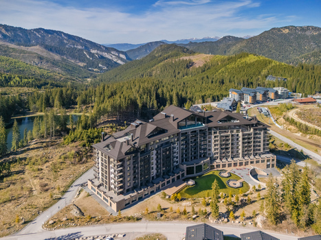 Aerial view of DAMIAN JASNA Hotel Resort Residences surrounded by dense pine forests and the Low Tatras mountains in Demanovska Dolina Zilinsky kraj Slovakia. Aerial view of DAMIAN JASNA Hotel Resort Residences surrounded by dense pine forests and the Low Tatras mountains in Demanovska Dolina Zilinsky kraj Slovakia.
