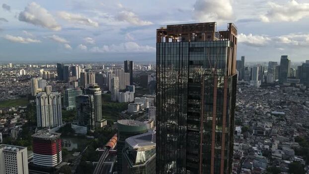 Aerial view of a modern skyscraper and urban skyline Indonesia. Aerial view of a modern skyscraper and urban skyline Indonesia.