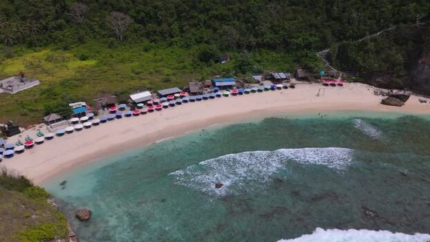 Aerial view of Diamond Beach with colorful umbrellas and clear water Indonesia. Aerial view of Diamond Beach with colorful umbrellas and clear water Indonesia.