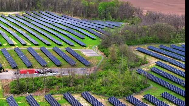 Aerial view of a solar farm with rows of photovoltaic panels United States. Aerial view of a solar farm with rows of photovoltaic panels United States.