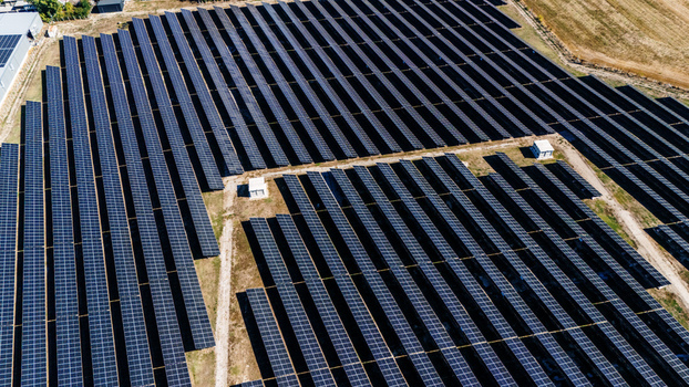 Aerial view of a large solar farm with rows of photovoltaic panels arranged in a field in Temerin Vojvodina Serbia. Aerial view of a large solar farm with rows of photovoltaic panels arranged in a field in Temerin Vojvodina Serbia.