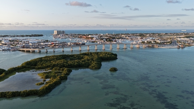Aerial view of Yucalpeten bridge spanning the turquoise water near lush mangroves and the harbor Progreso Yucatan Mexico. Aerial view of Yucalpeten bridge spanning the turquoise water near lush mangroves and the harbor Progreso Yucatan Mexico.