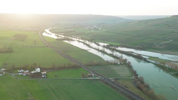 Aerial view of river and green fields France.