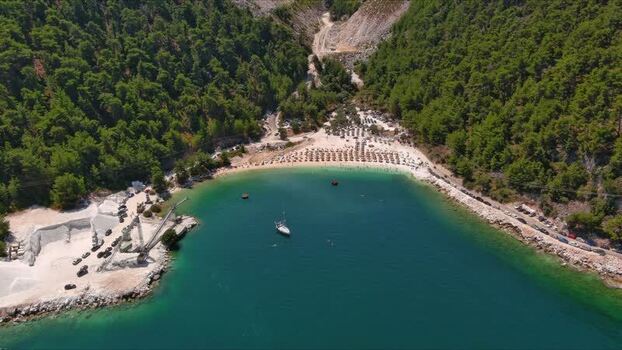 Aerial view of Marble Beach with turquoise water in Thasos Greece. Aerial view of Marble Beach with turquoise water in Thasos Greece.