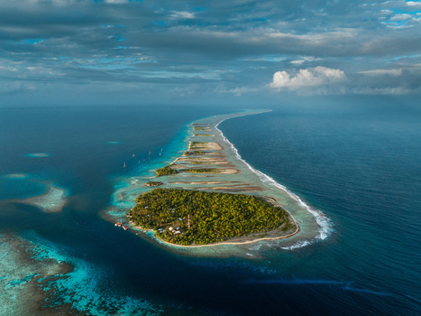 Aerial view of a tropical atoll featuring lush green islets surrounded by turquoise lagoons and vibrant coral reefs Moorea Maiao Windward Islands French Polynesia. Aerial view of a tropical atoll featuring lush green islets surrounded by turquoise lagoons and vibrant coral reefs Moorea Maiao Windward Islands French Polynesia.