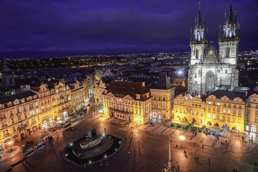 Aerial view of the Church of Our Lady before Tyn illuminated at night in the historic Old Town Square of Prague Prague Czechia. Aerial view of the Church of Our Lady before Tyn illuminated at night in the historic Old Town Square of Prague Prague Czechia.