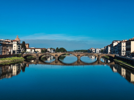 Florence Italy 26 April 2026 View of the historic Ponte alla Carraia spanning the Arno River with traditional buildings and a clear blue sky in Florence Tuscany Italy. Florence Italy 26 April 2026 View of the historic Ponte alla Carraia spanning the Arno River with traditional buildings and a clear blue sky in Florence Tuscany Italy.