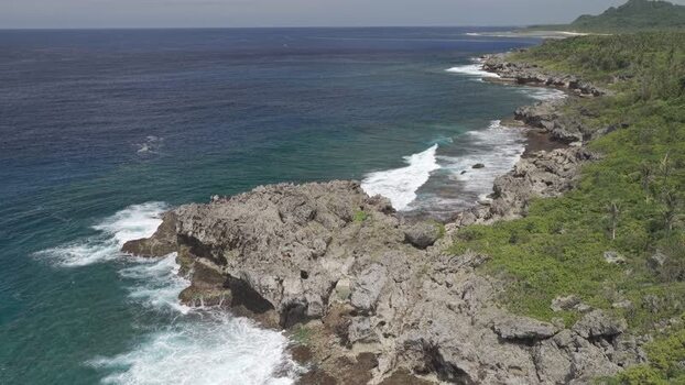 Aerial view of the rocky coastline of Siargao Island Philippines.