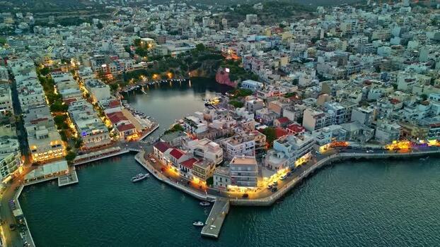 Aerial view of Agios Nikolaos harbor and Voulismeni Lake Greece.