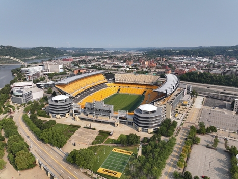 Pittsburgh Pennsylvania United States 26 July 2026 Aerial view of Acrisure Stadium featuring its iconic yellow seating green field and surrounding urban landscape along the river.
