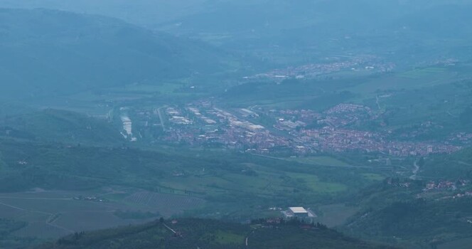 Aerial view of the misty valley and town rooftops in Vallombrosa Italy. Aerial view of the misty valley and town rooftops in Vallombrosa Italy.