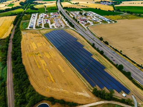 Aerial view of Serways Raststatte Hohenlohe Sud with its large solar farm adjacent highway and surrounding agricultural fields in Neuenstein Baden Wurttemberg Germany. Aerial view of Serways Raststatte Hohenlohe Sud with its large solar farm adjacent highway and surrounding agricultural fields in Neuenstein Baden Wurttemberg Germany.