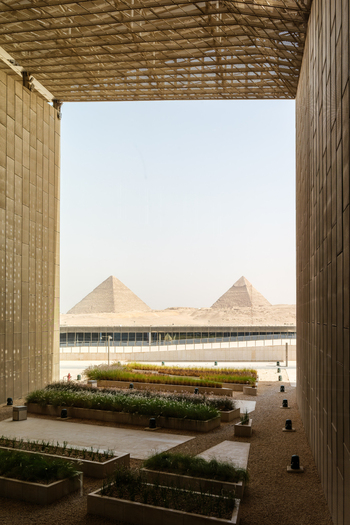 Giza Governorate Egypt 16 May 2026 View of the Grand Egyptian Museum looking towards the Great Pyramids of Giza with garden beds and modern architecture. Giza Governorate Egypt 16 May 2026 View of the Grand Egyptian Museum looking towards the Great Pyramids of Giza with garden beds and modern architecture.