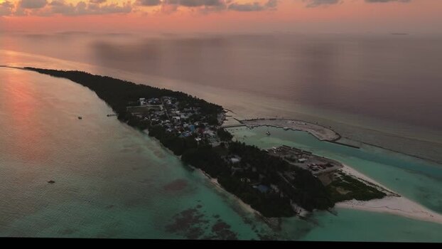 Aerial view of Fulhadhoo island at sunset Maldives.