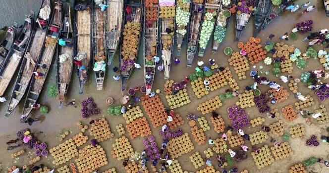 Aerial view of a colorful floating market with boats Bangladesh.