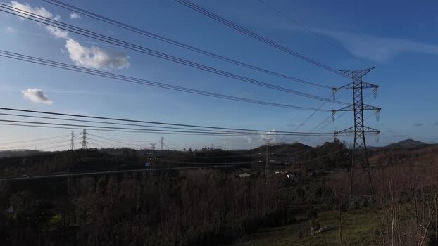 Aerial view of power lines over trees Portugal.
