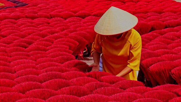 View of a worker at Quang Phu Cau incense village Vietnam.