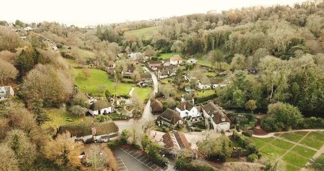 Aerial view of thatched cottages in Cockington United Kingdom. Aerial view of thatched cottages in Cockington United Kingdom.