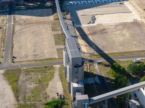 Aerial view of the Janschwalde Power Station industrial site featuring large silos conveyor belts and cleared land during the transition from coal power in Peitz Brandenburg Germany. Aerial view of the Janschwalde Power Station industrial site featuring large silos conveyor belts and cleared land during the transition from coal power in Peitz Brandenburg Germany.