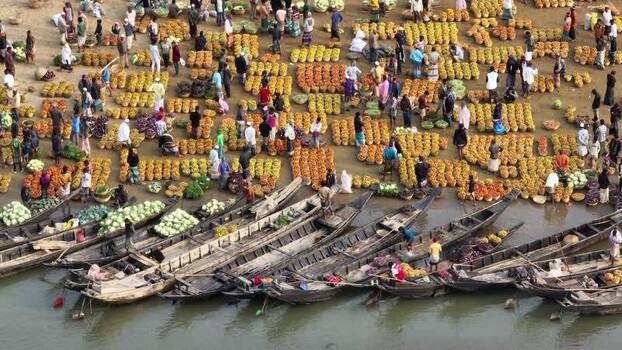 Aerial view of a bustling riverside market in Sylhet Bangladesh.