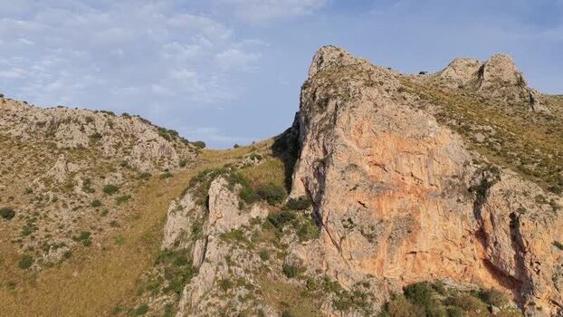 Aerial view of rugged coastal cliffs in Terrasini Italy.