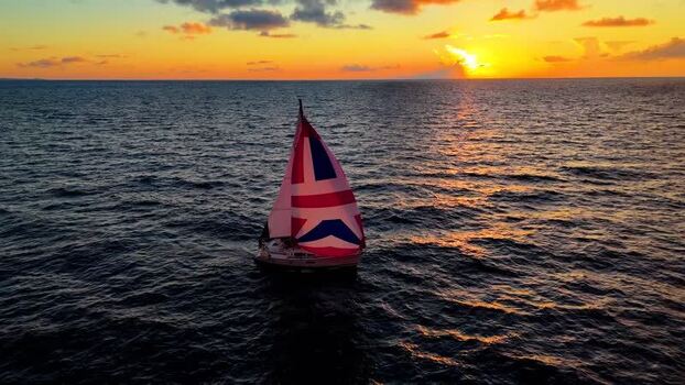 Aerial view of a sailboat with a Union Jack sail United States. Aerial view of a sailboat with a Union Jack sail United States.