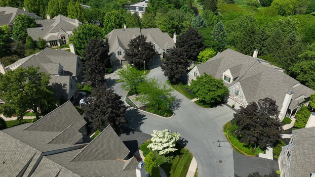 Aerial view of a retirement community campus in West Lampeter Township with stone buildings paved roads and lush trees in Willow Street Pennsylvania United States.