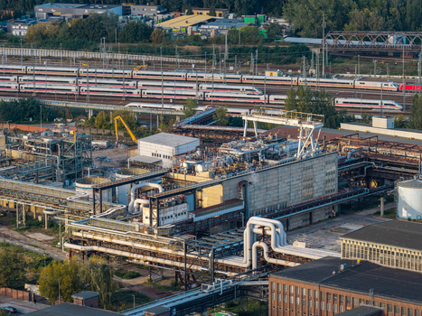 Aerial view of the Heizkraftwerk Klingenberg combined heat and power plant with its industrial piping storage tanks and nearby railway tracks in Berlin Berlin Germany. Aerial view of the Heizkraftwerk Klingenberg combined heat and power plant with its industrial piping storage tanks and nearby railway tracks in Berlin Berlin Germany.