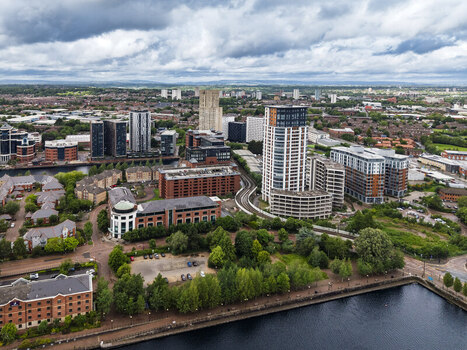 Aerial view of MediaCityUK featuring modern high rise residential buildings commercial offices and waterfront areas along the canal in Salford England United Kingdom. Aerial view of MediaCityUK featuring modern high rise residential buildings commercial offices and waterfront areas along the canal in Salford England United Kingdom.
