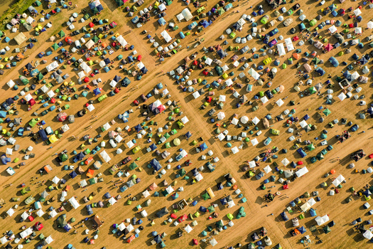 Aerial view of the Open Beatz Festival campsite with hundreds of colorful tents arranged along dirt paths in Herzogenaurach Bayern Germany. Aerial view of the Open Beatz Festival campsite with hundreds of colorful tents arranged along dirt paths in Herzogenaurach Bayern Germany.