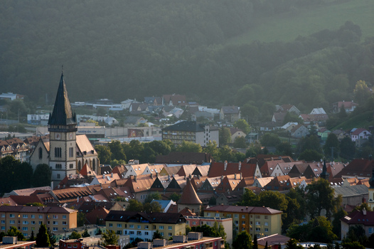 Aerial view of the Basilica of St. Giles and the historic red tiled rooftops of the old town surrounded by forested hills in Bardejov Presov Region Slovakia. Aerial view of the Basilica of St. Giles and the historic red tiled rooftops of the old town surrounded by forested hills in Bardejov Presov Region Slovakia.