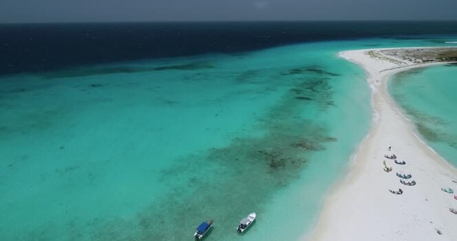 Aerial view of Los Roques archipelago beach and boats Venezuela.