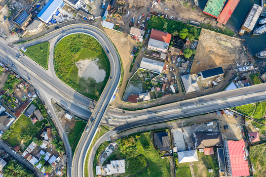 Port Harcourt Nigeria 03 July 2026 Aerial view of a highway interchange with a curved ramp and surrounding urban development. Port Harcourt Nigeria 03 July 2026 Aerial view of a highway interchange with a curved ramp and surrounding urban development.