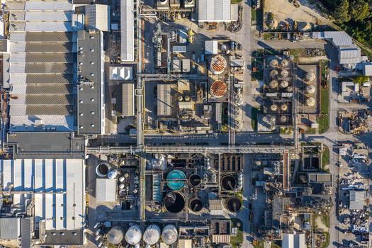 Aerial view of an industrial plant with large factory buildings storage tanks and complex pipeline networks in Nera Montoro Umbria Italy. Aerial view of an industrial plant with large factory buildings storage tanks and complex pipeline networks in Nera Montoro Umbria Italy.