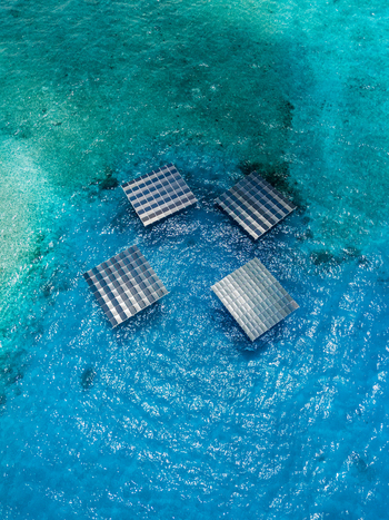Aerial view of SolarSea floating solar power plant platforms by Swimsol on turquoise ocean water in Dharavandhoo Baa Atoll Maldives. Aerial view of SolarSea floating solar power plant platforms by Swimsol on turquoise ocean water in Dharavandhoo Baa Atoll Maldives.