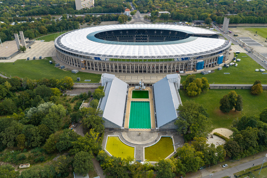 Berlin Germany 26 September 2026 Aerial view of Olympiastadion Berlin with its iconic architecture surrounding parkland and the adjacent swimming pool complex.