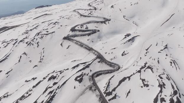 Aerial view of the winding road on Mount Etna Italy. Aerial view of the winding road on Mount Etna Italy.