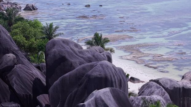 Aerial view of Anse Reunion beach and granite boulders Seychelles.