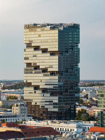 Aerial view of the modern glass facade EDGE East Side Tower skyscraper rising above the surrounding urban landscape of Berlin Berlin Germany. Aerial view of the modern glass facade EDGE East Side Tower skyscraper rising above the surrounding urban landscape of Berlin Berlin Germany.