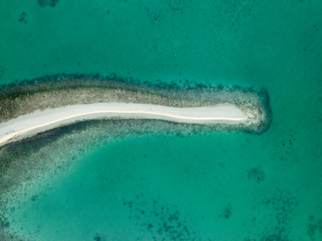 Aerial view of Pungtud sandbank surrounded by clear turquoise water and coral reefs in Panglao Philippines. Aerial view of Pungtud sandbank surrounded by clear turquoise water and coral reefs in Panglao Philippines.