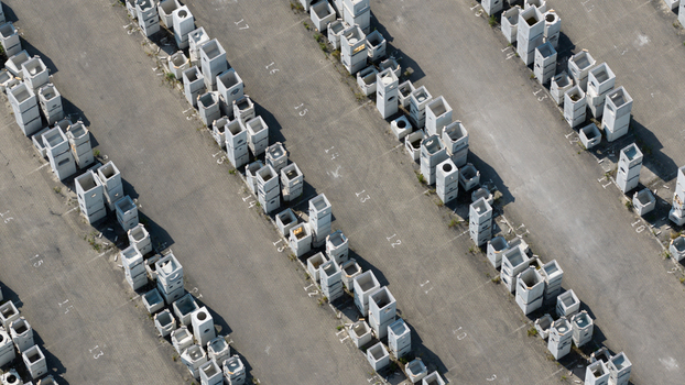 Aerial view of rows of precast concrete blocks stacked in an industrial storage yard with painted numbers on the asphalt ground in Oosterhout North Brabant Netherlands. Aerial view of rows of precast concrete blocks stacked in an industrial storage yard with painted numbers on the asphalt ground in Oosterhout North Brabant Netherlands.