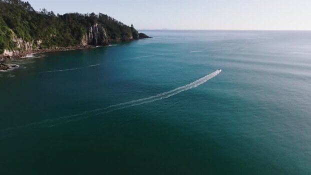 Aerial view of boat on ocean near Whangamata New Zealand. Aerial view of boat on ocean near Whangamata New Zealand.