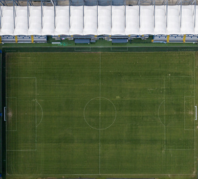 Aerial view of a football stadium pitch with green grass and white canopy roof in Istanbul Istanbul Turkiye. Aerial view of a football stadium pitch with green grass and white canopy roof in Istanbul Istanbul Turkiye.
