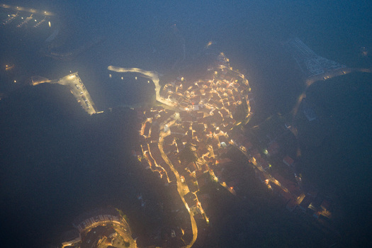 Aerial view of the historic town glowing through thick night mist and fog Cudillero Asturias Spain. Aerial view of the historic town glowing through thick night mist and fog Cudillero Asturias Spain.